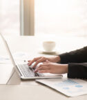 businesswoman-working-with-diagrams-at-office-using-laptop-close-up (1)_0