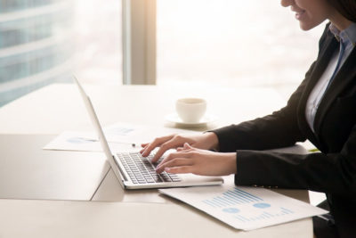 businesswoman-working-with-diagrams-at-office-using-laptop-close-up (1)_0